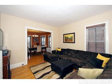 LIVING ROOM LOOKING INTO DINING ROOM.