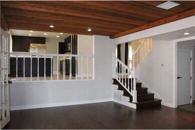 Inviting family room boasts wood laminate floors, 