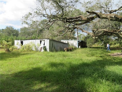 View of yard with an outbuilding