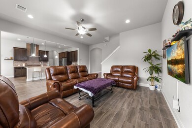 Living room with recessed lighting, dark wood-sty