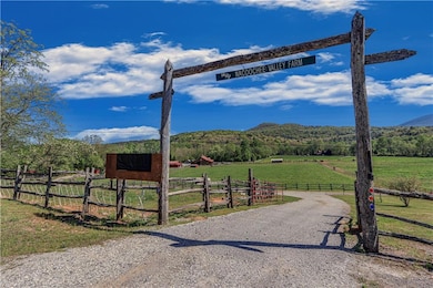 View of road featuring driveway, a mountain view, 