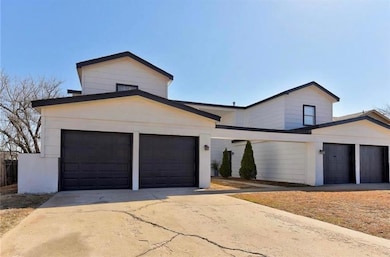 View of front facade with driveway and an attached garage