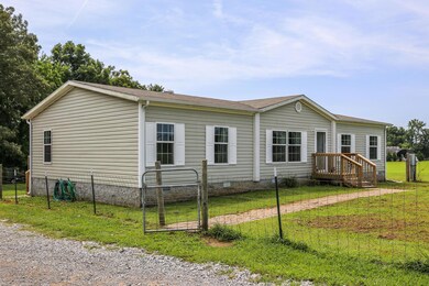 Front sidewalk leads to front porch.