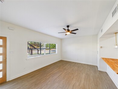 Spare room with light wood-style flooring and a ceiling fan