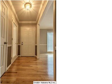 Foyer with gleaming hardwoods