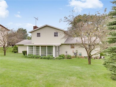 Three season sun room with two sliding glass doors