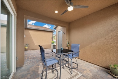 View of patio featuring ceiling fan and outdoor di