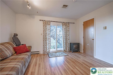 Lower Level Family room and Half a Bath. Leads to the patio and a backyard