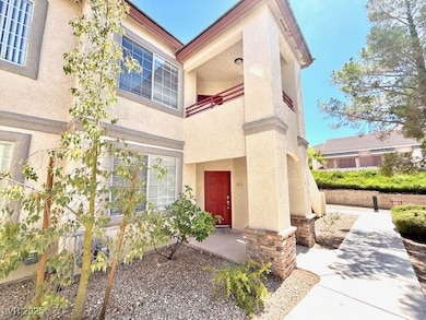 View of exterior entry with stucco siding