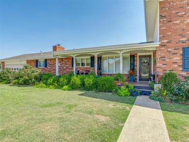 View of front of home with covered porch and a fro