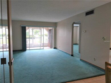 View of great room through to screened portion of 