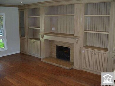 built in bookcases surround fireplace in living ro