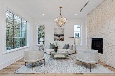 Cozy up by the fire in the formal living room at the entrance to the home
