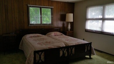 Main level Master bedroom with view of Lake Wawase