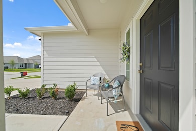Another view of the charming front porch. Large en