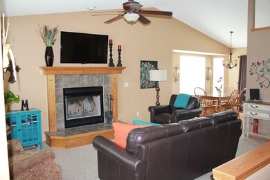 Ceiling is vaulted and extends into dining and kit