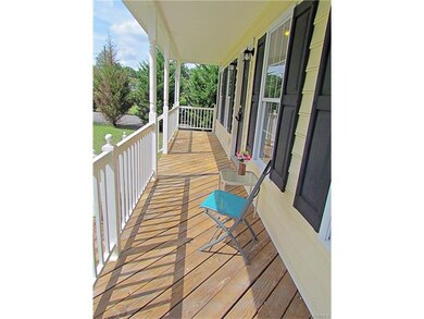 Full country porch perfect for relaxing after a lo