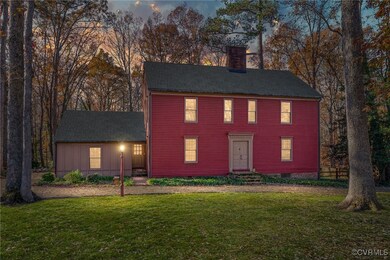 Colonial-style house with a yard