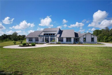 View of front of property featuring a front lawn,