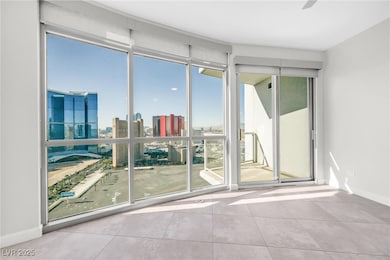 Unfurnished room with tile patterned floors, a vie