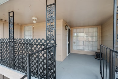 View of balcony and entrance.