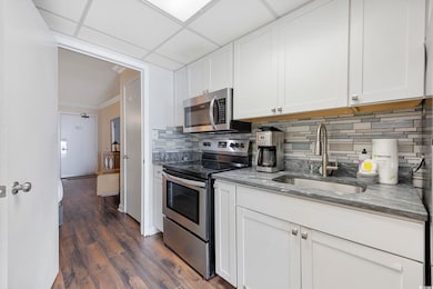 Kitchen with appliances with stainless steel finis