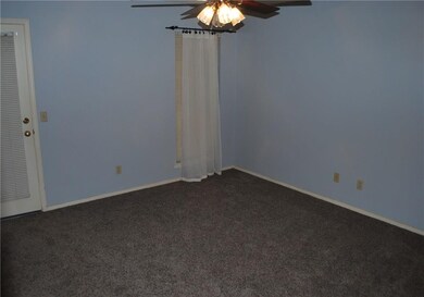 master bedroom with door to sunroom