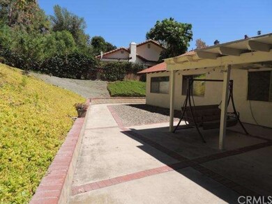 Huge backyard with slope which creates privacy & a