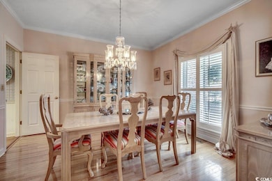 Dining area featuring light wood-style floors, an 