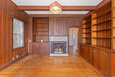 Unfurnished living room featuring light wood-type 