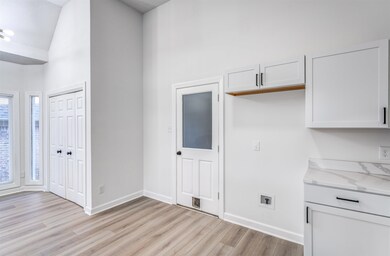 Interior space featuring light stone counters, whi