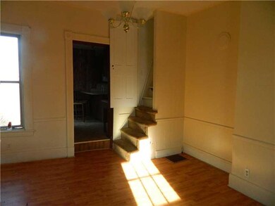 Dining Room. Step up into kitchen.  Stairs lead to