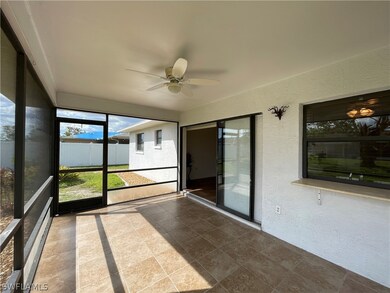 Sliders open completely to a tiled, screened lanai measuring appx 15'x9'.