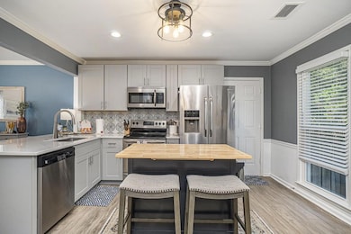 Updated Stylish Kitchen With Quartz Counters & Stainless Steel Appliances