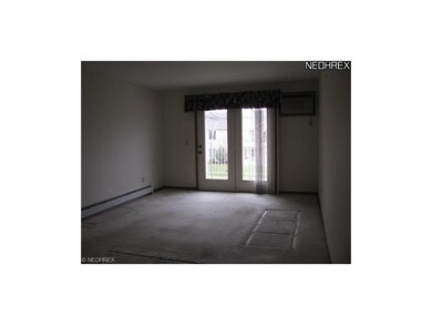 Spacious living room with door to outside patio ar