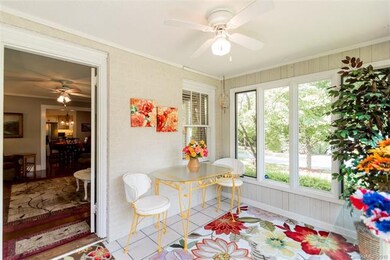 Enter back door thru this sun porch full of light.