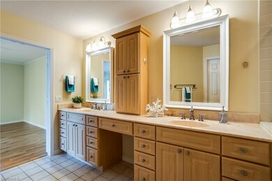 Master Bathroom offers doubles sinks, vanity & a p