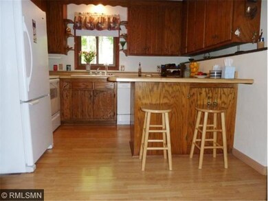 Oak pergo-style flooring compliments the cabinetry
