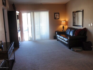 Living Room with Glass Doors to Balcony