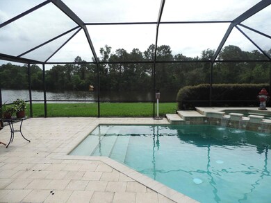 view of pool, lake and preserve