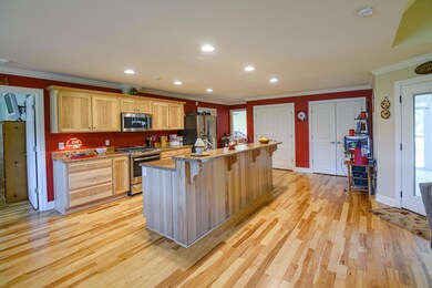 Custom hickory cabinets with extra long island, double pantries