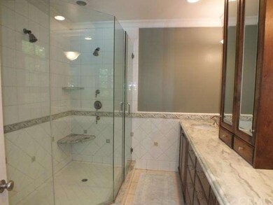 Luxurious shower with dual shower heads and seat
