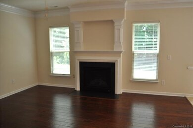 Fireplace with hearth and art niche above.  Family