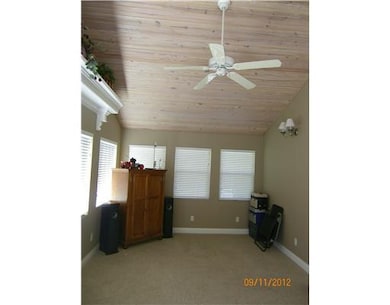 Sun Room. Vaulted cedar ceiling and miniature heat pump unit in sunroom. Windows on all 3 exterior walls.