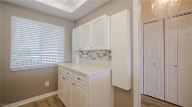 The kitchen has TONS of extra storage, glass front