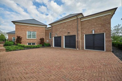 hgc 3 car garage brick driveway
