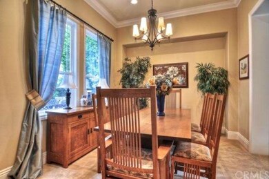 Formal dining room with large windows overlooking 