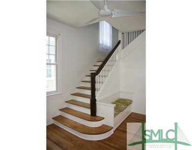 Other. Gracious stairway with built in bench/chest