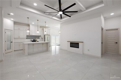 Kitchen featuring visible vents, open floor plan, ceiling fan, recessed lighting, and coffered ceiling