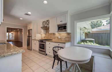 Large kitchen area with breakfast area overlooking